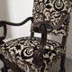 Pair of ceremonial armchairs in blackened oak, France late 18th century.
