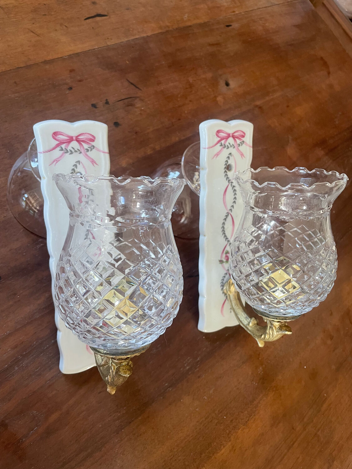 Pair of cut glass and Limoges porcelain wall sconces