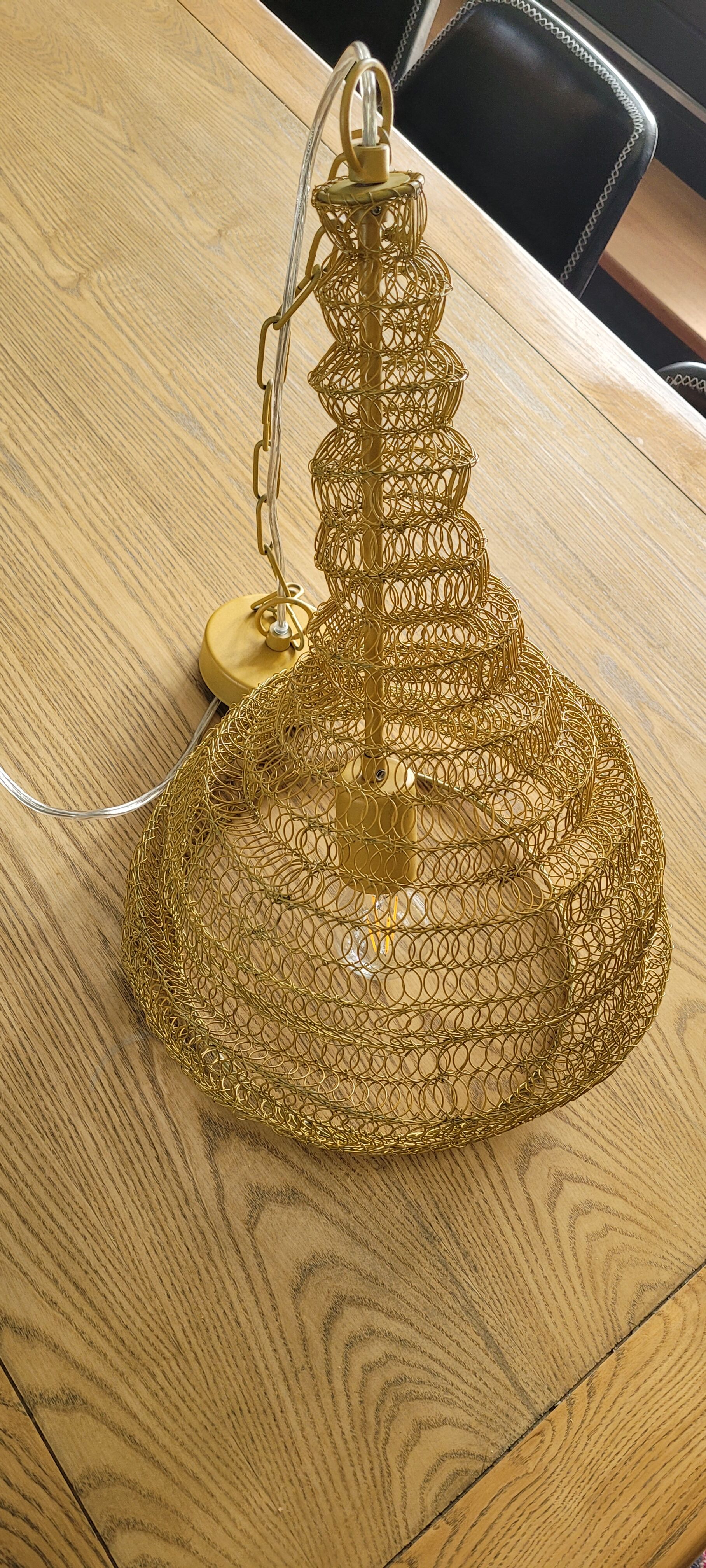 Mustard-coloured metal mesh suspension