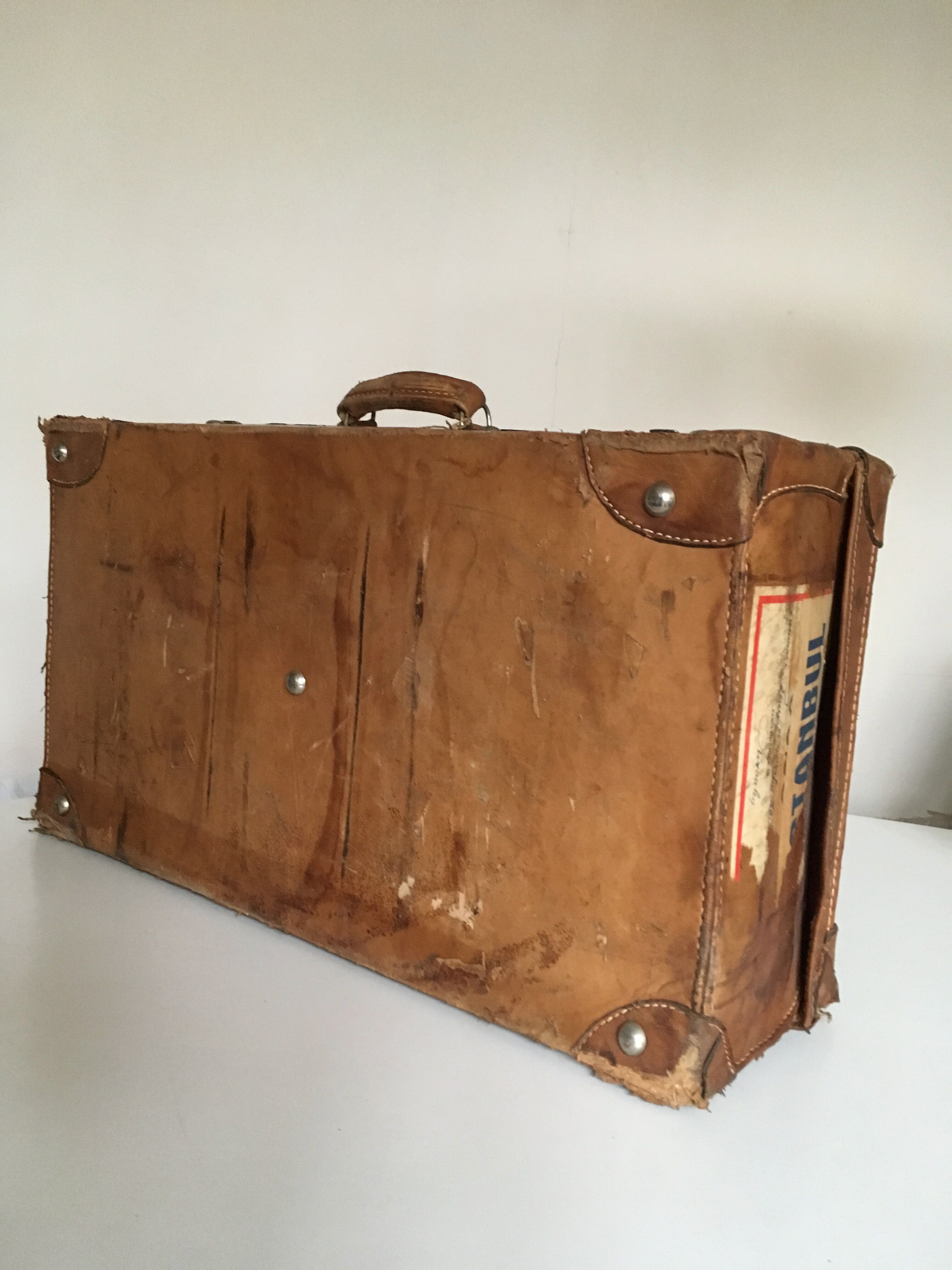 suitcase of leather with labels of palaces