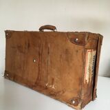 suitcase of leather with labels of palaces