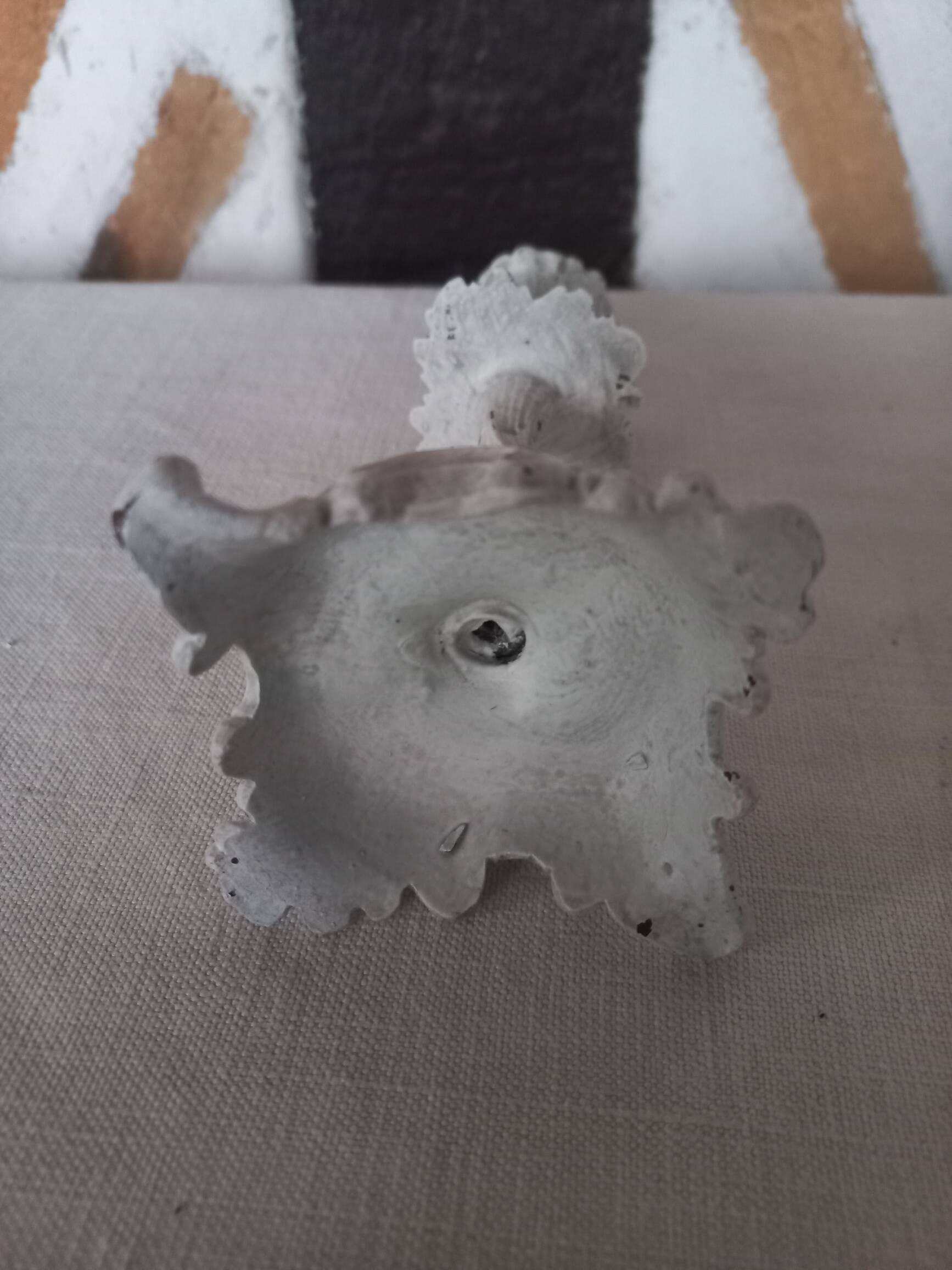 Old grayed white patinated candle holder
