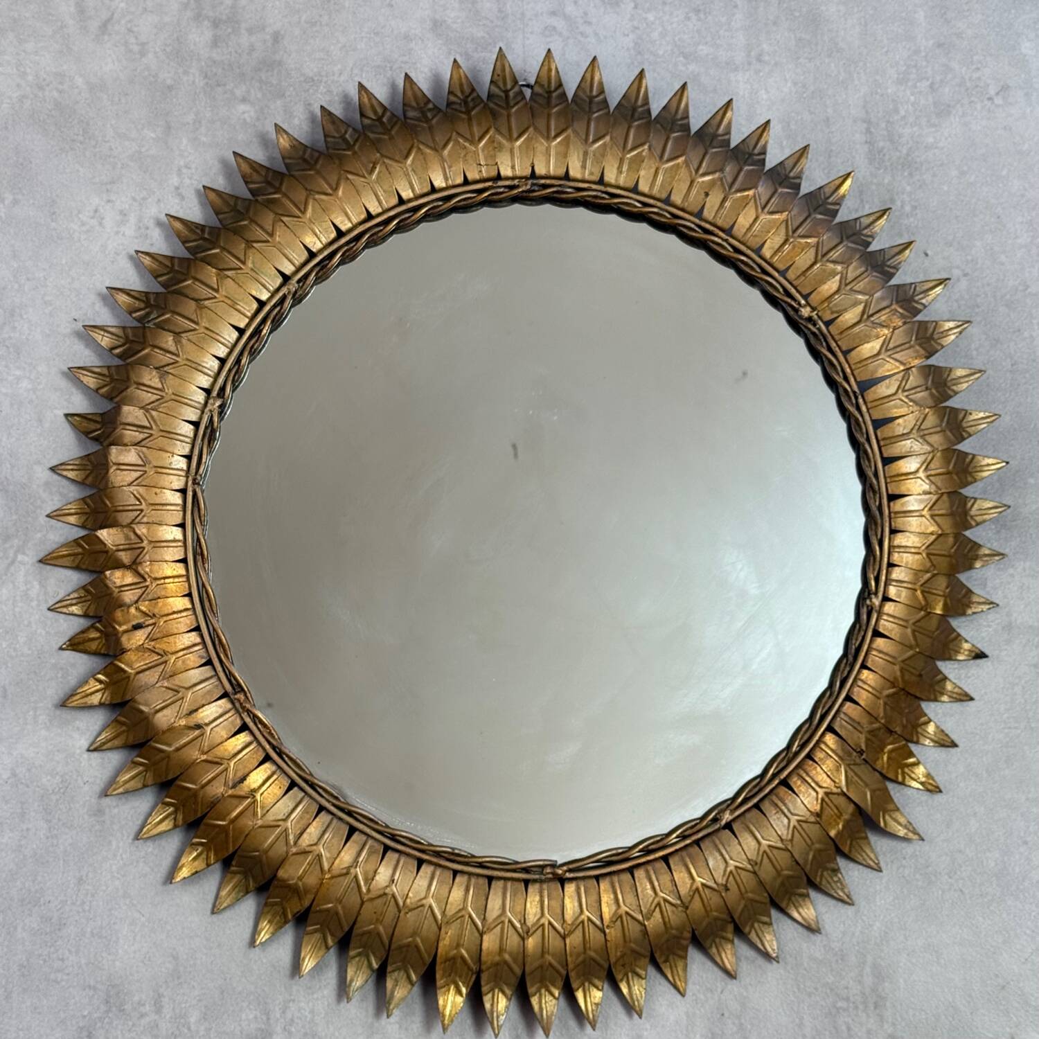 Round sun mirror in wrought iron from the 1950s Italy.