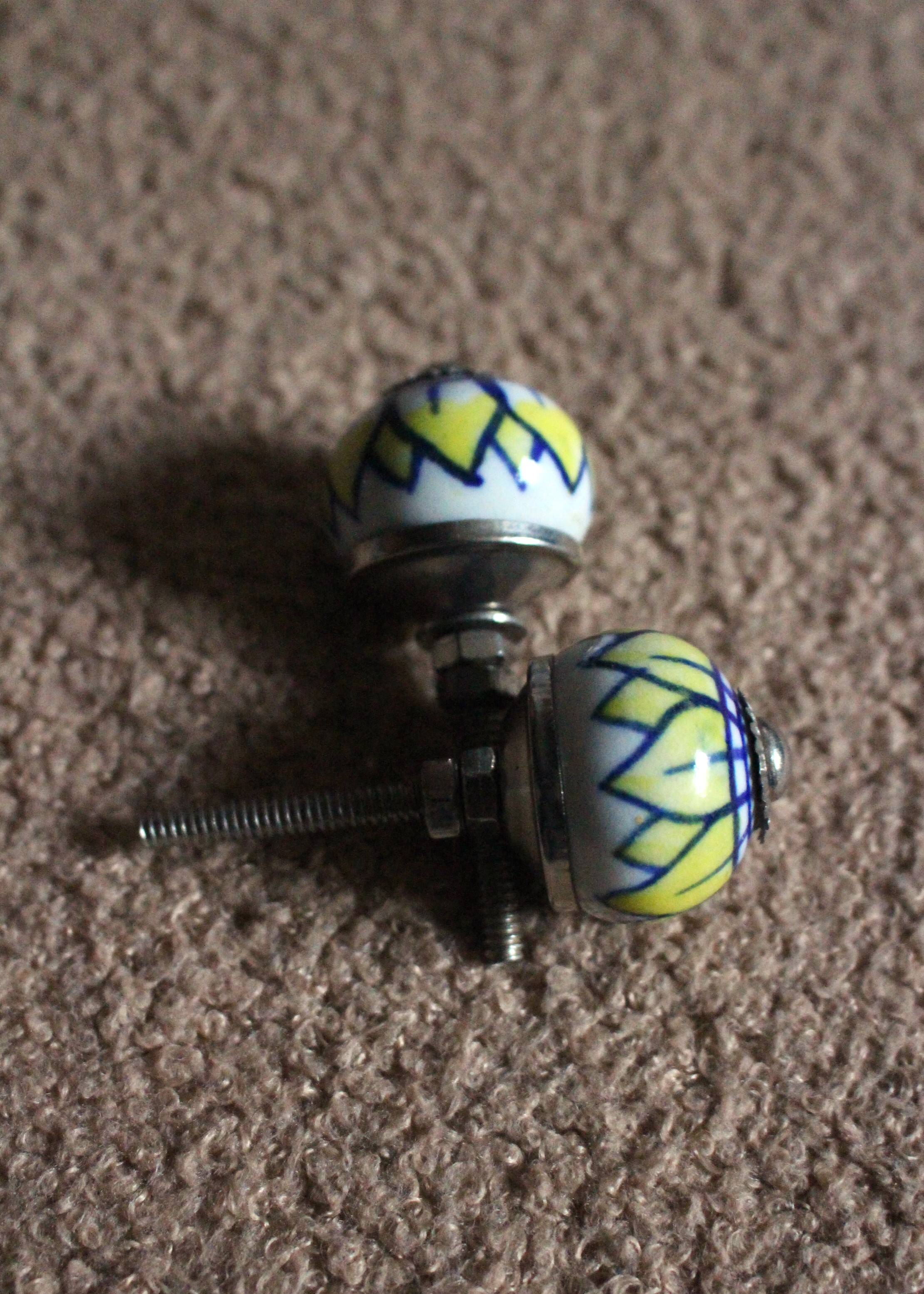 Pair of blue, yellow and white porcelain drawer cupboard door knobs
