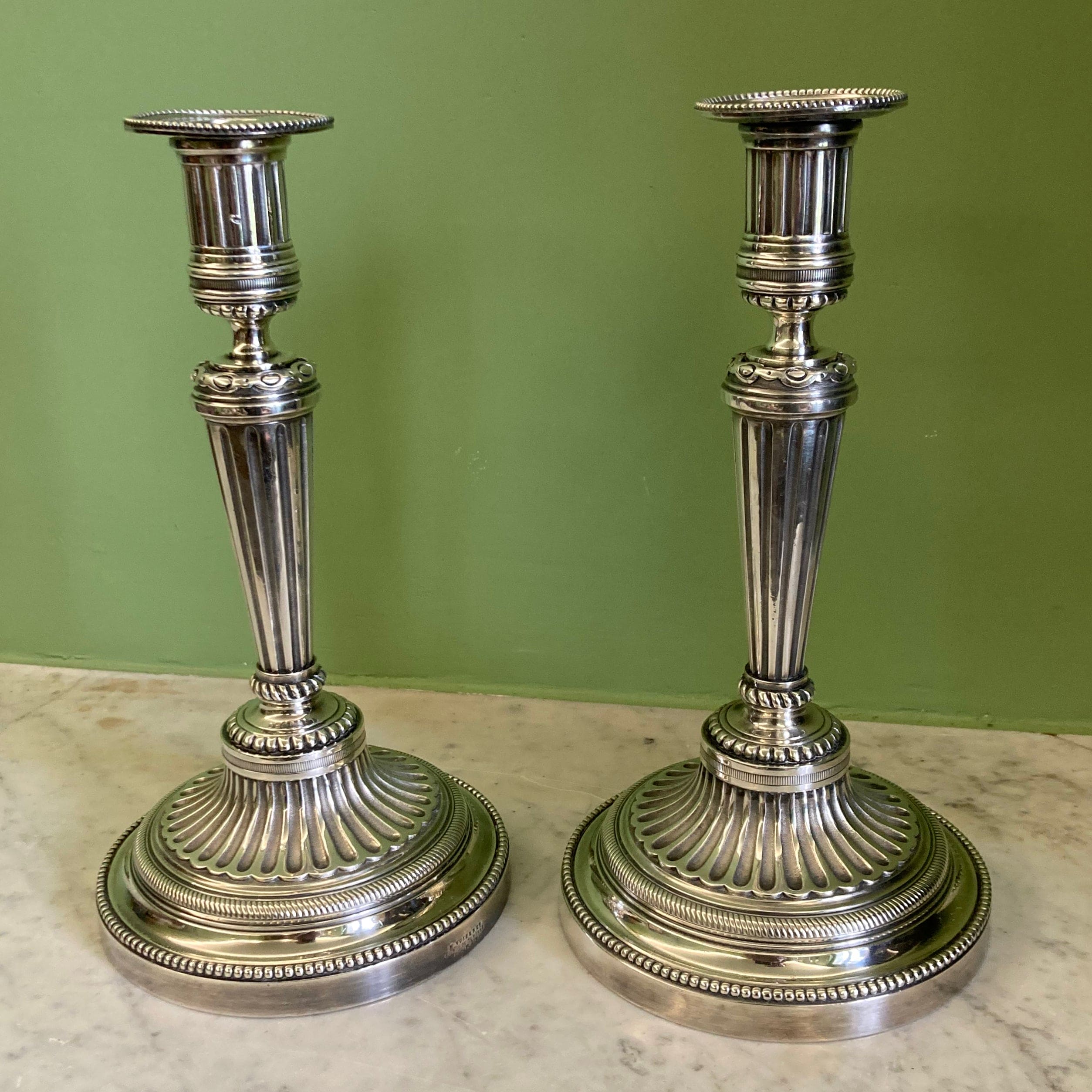 Pair of silvered bronze candlesticks from the 19th century in Louis XVI style signed Voisenet.