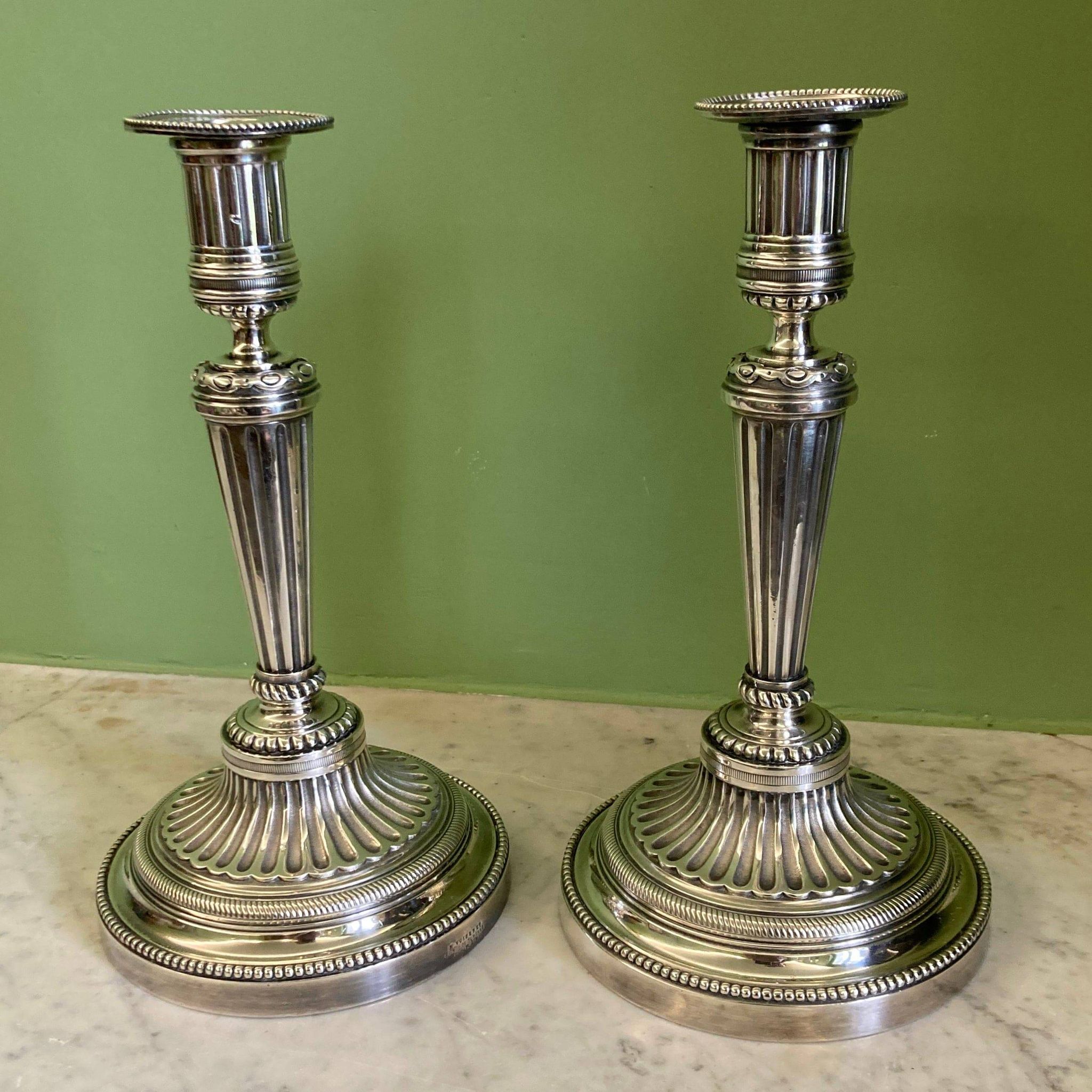 Pair of silvered bronze candlesticks in the Louis XVI style signed Voisenet, 19th century.