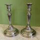 Pair of silvered bronze candlesticks from the 19th century in Louis XVI style signed Voisenet.