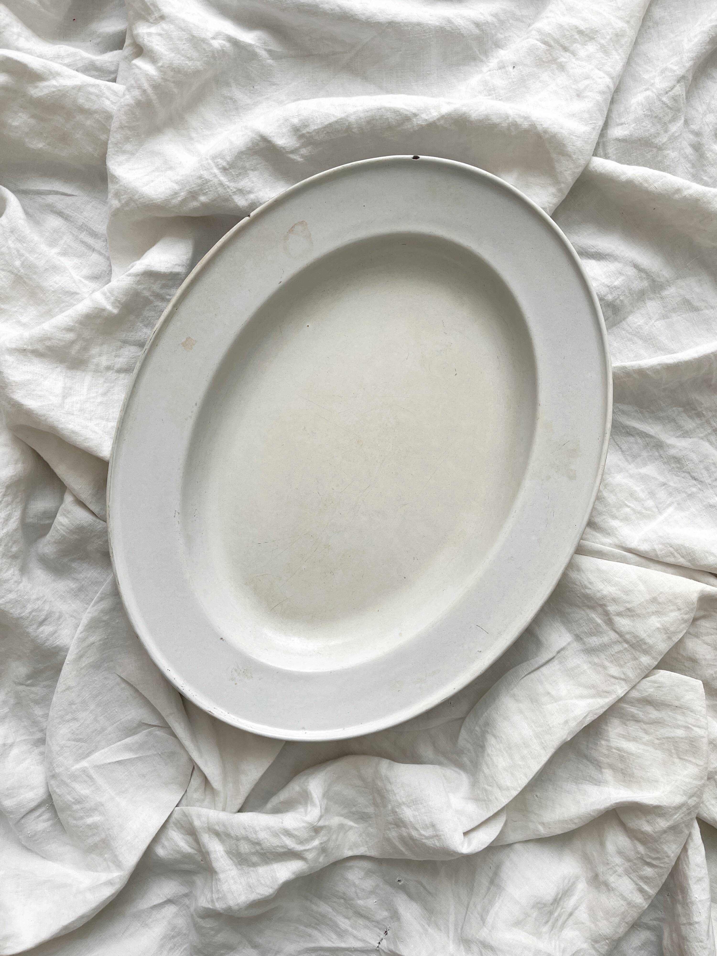 Vintage marbled white and blue enameled sheet metal oval dish