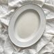 Vintage marbled white and blue enameled sheet metal oval dish
