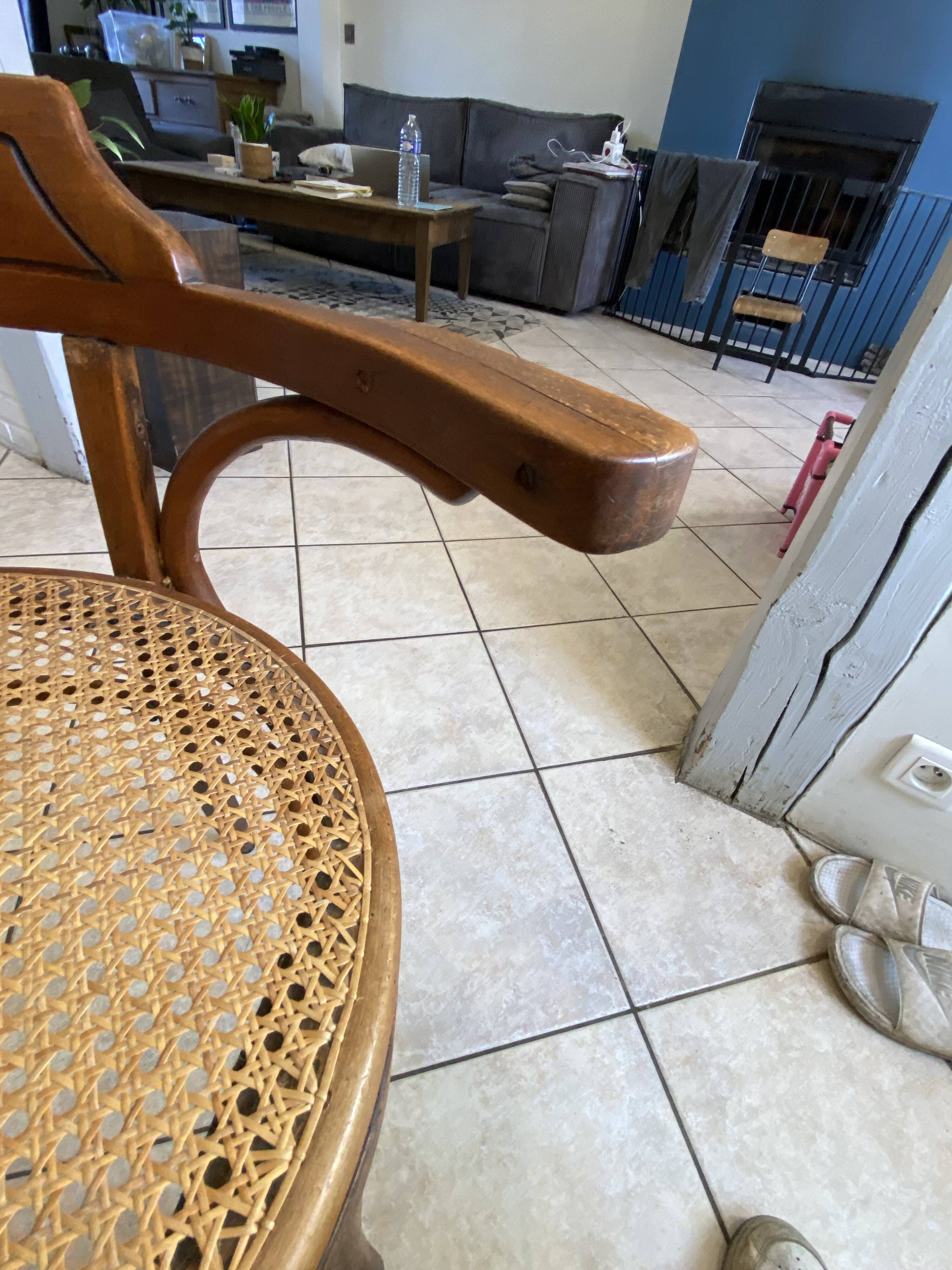 Bistro chair with a curved wooden frame and caned seat from the 1930s.
