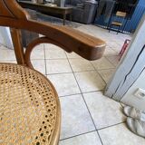 Bistro chair with a curved wooden frame and caned seat from the 1930s.