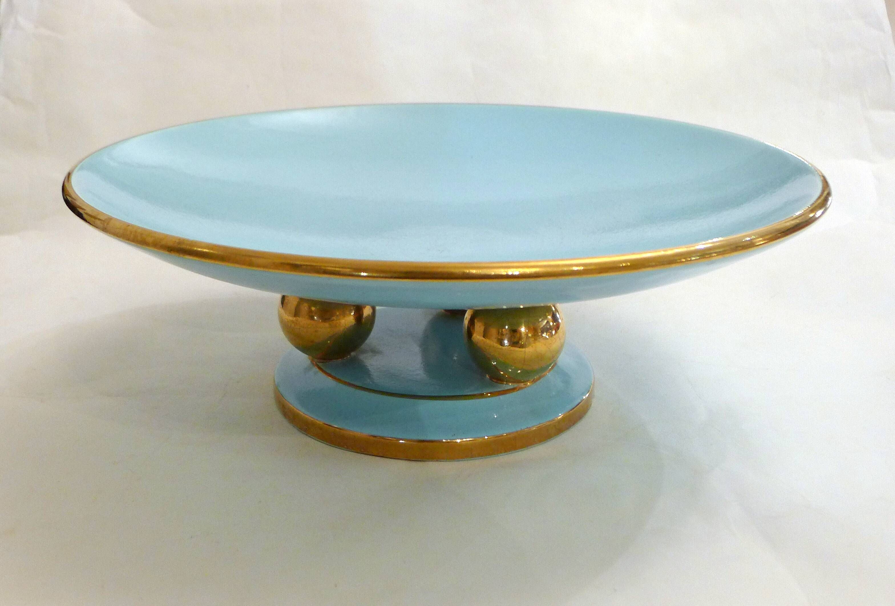 Art Deco modernist coupe, with a base of 3 spheres, in turquoise ceramic and gilding.