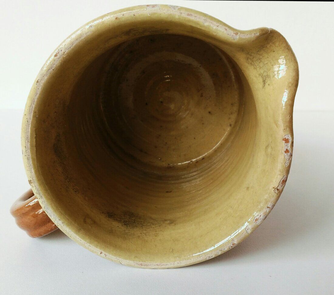 Old pitcher pot in glazed earth