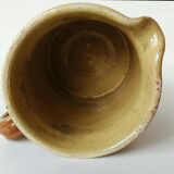 Old pitcher pot in glazed earth