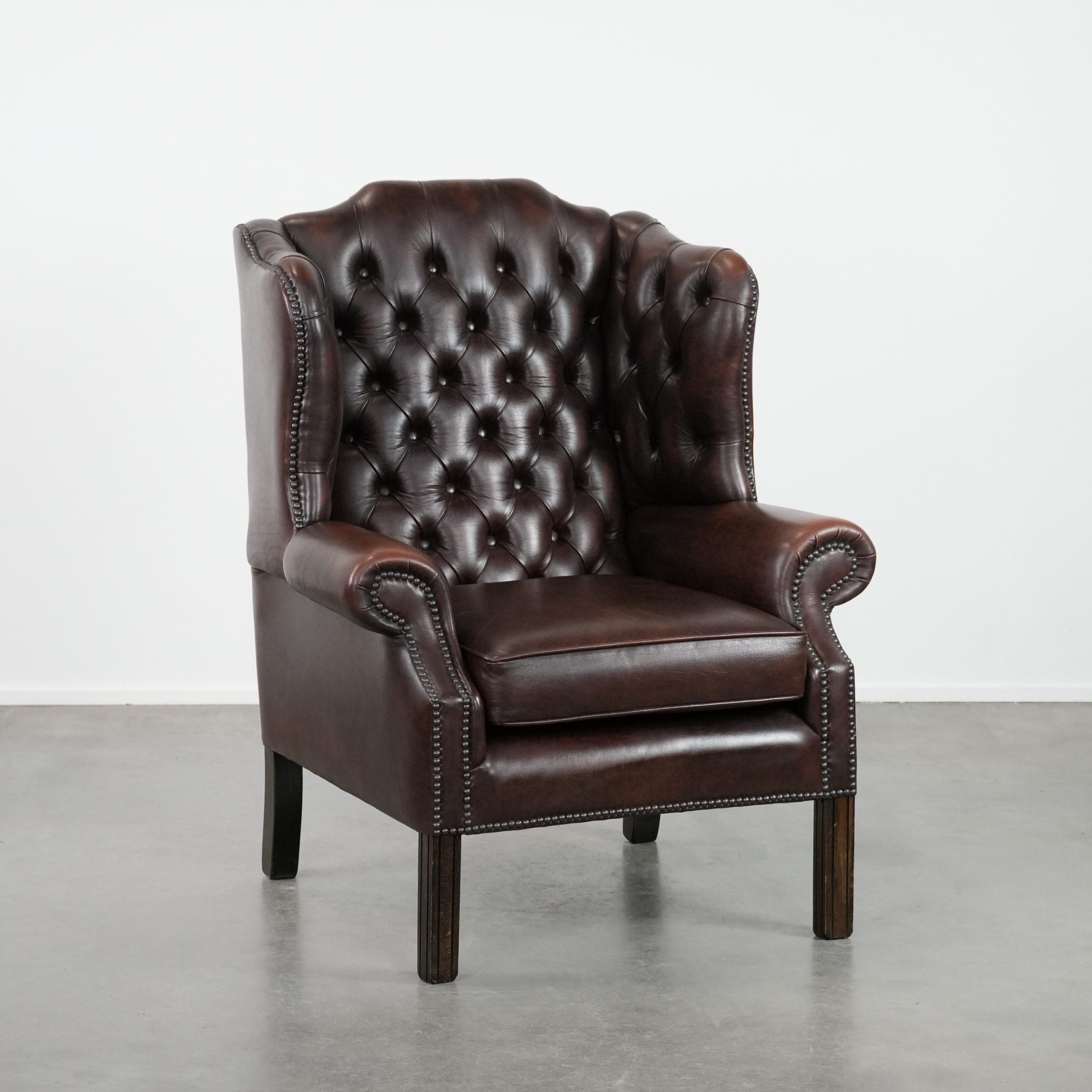 Brown cowhide leather Chesterfield wingback armchair in English style