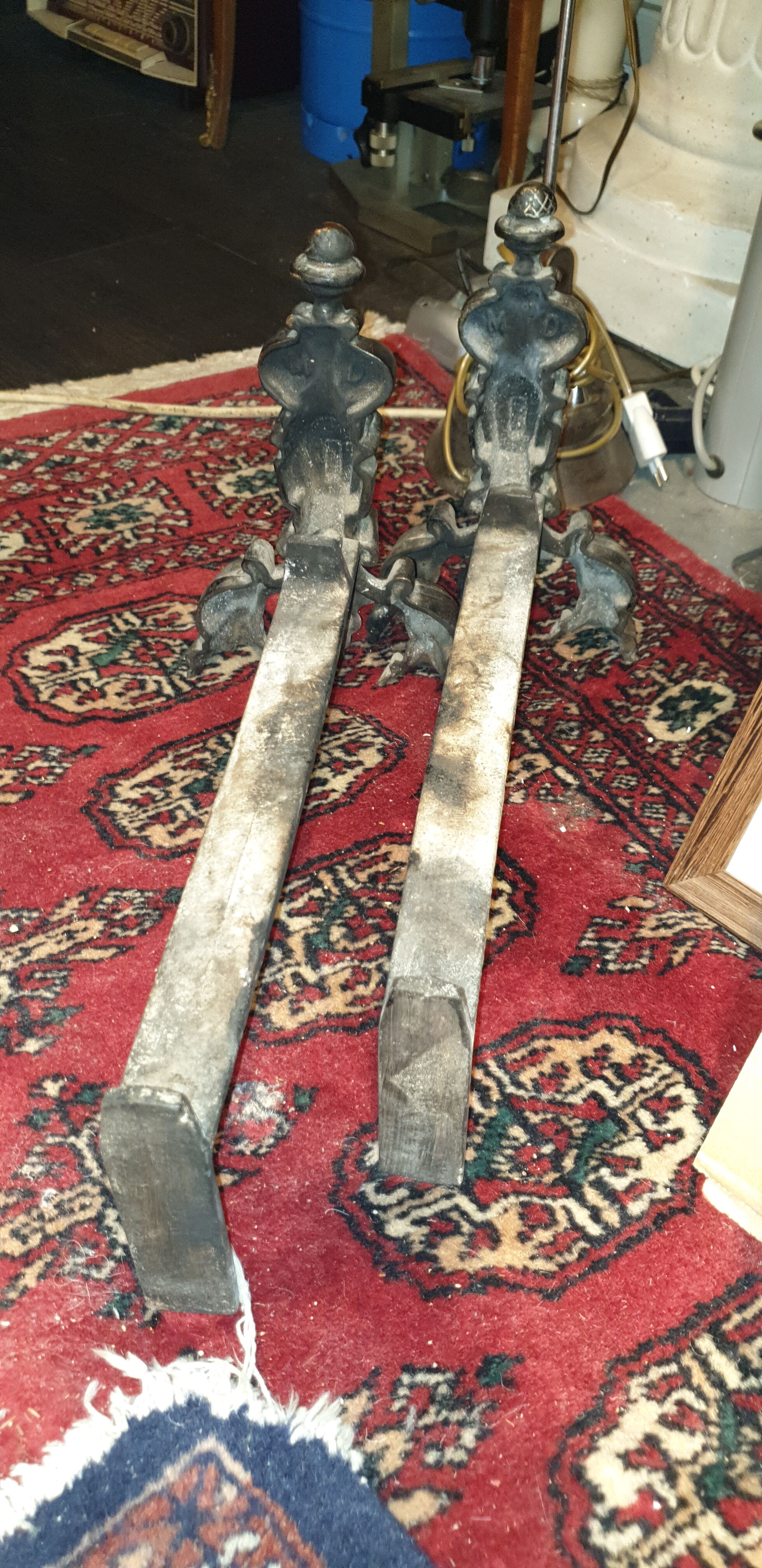 Pair of cast iron and bronze chenets