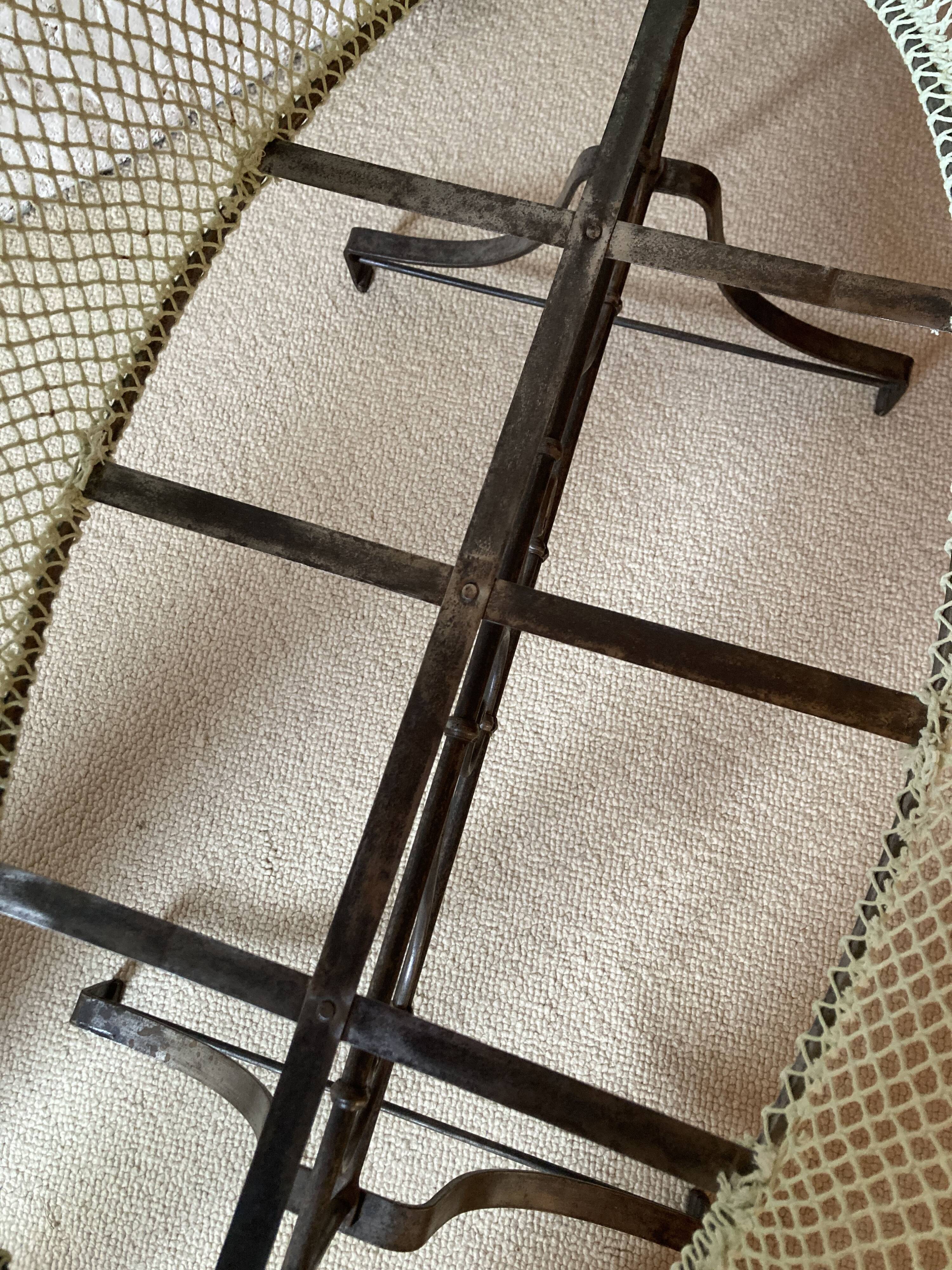 Antique rocking cradle in wrought iron