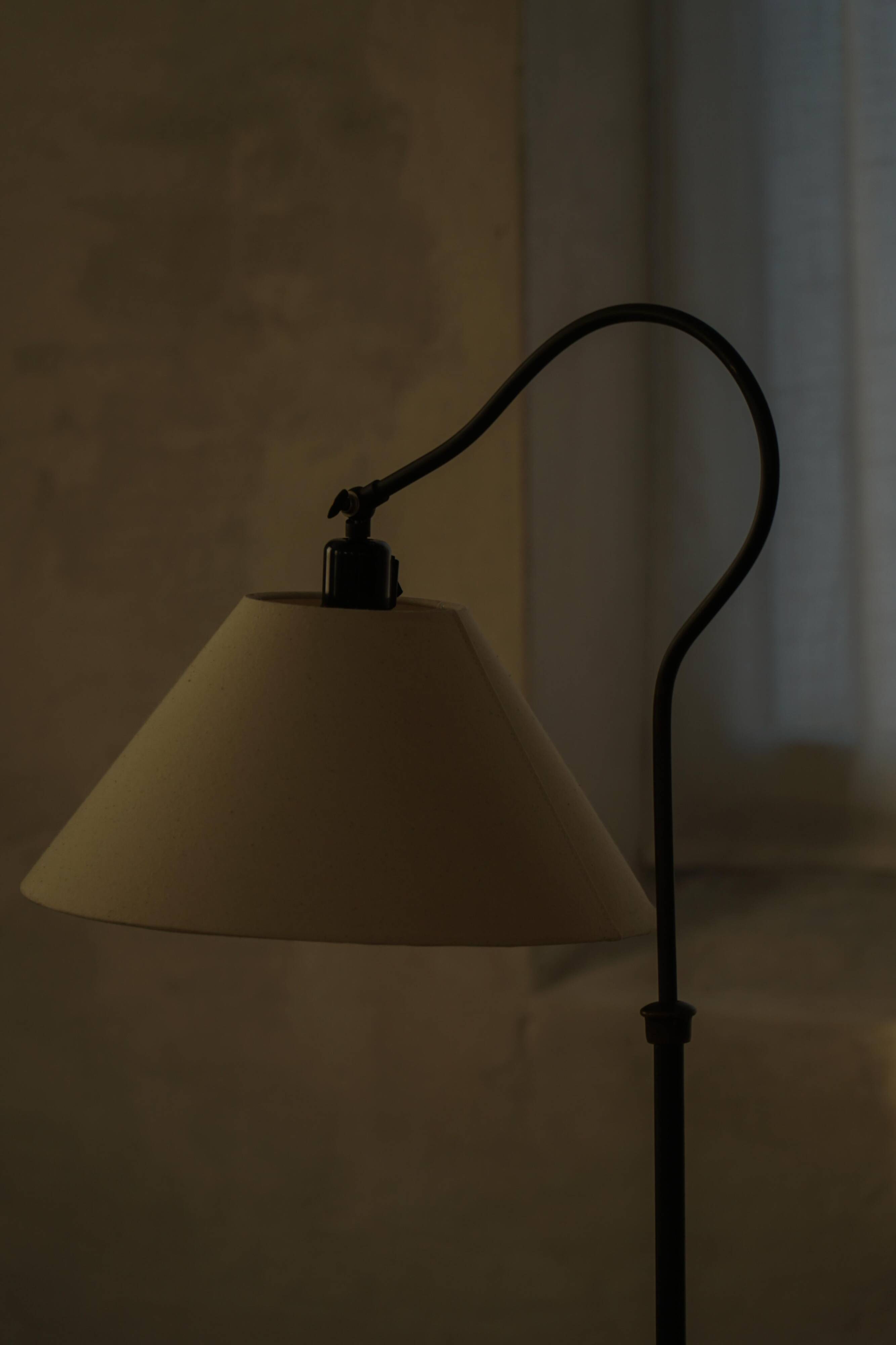 Danish wrought iron floor lamp from the mid-20th century with a curved arm, 1950s.