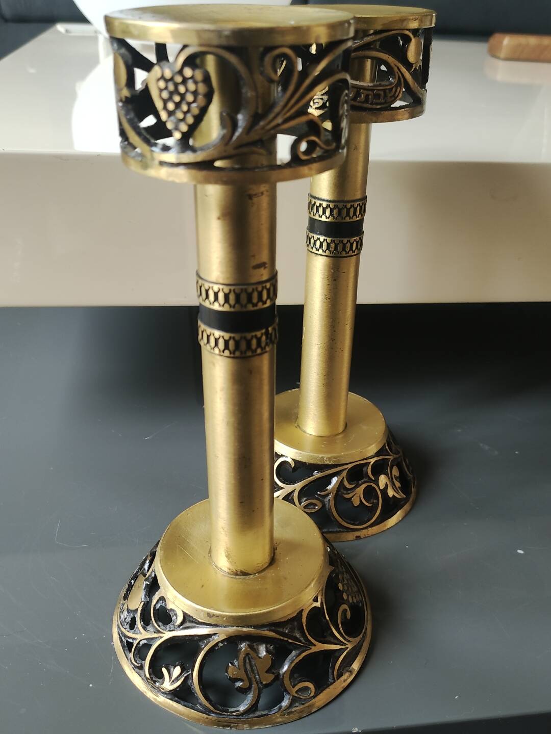 Pair of Hebrew Candlesticks. In antique gold-plated brass. Signed FFS Israel
