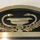 Neoclassical style mirror in brass and lacquered sheet metal.