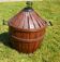 Green demijohn jacket with a basket and handles