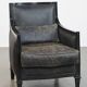 Armchair in black cowhide leather and wood with an Art Deco design