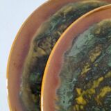 Set of 4 flamed enamel plates in green and amber from the 60s-70s.