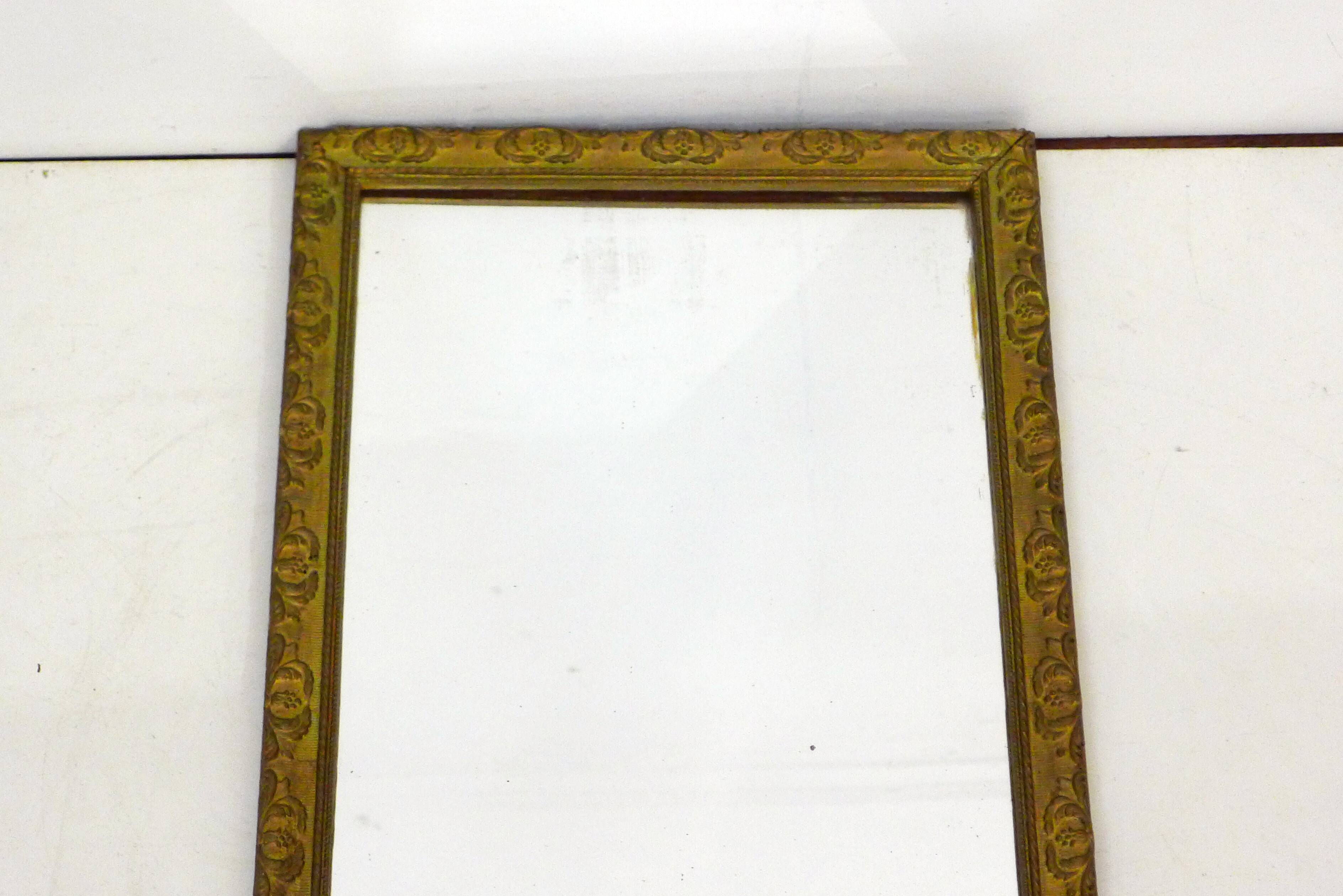 Large elongated gilded mirror