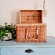 Small suitcase in vintage rattan trunk