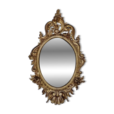 Large oval gold mirror, Louis XV rococo style, late 19th century, 114 x 66 cm.