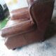Fauteuil chesterfield à oreille cuir