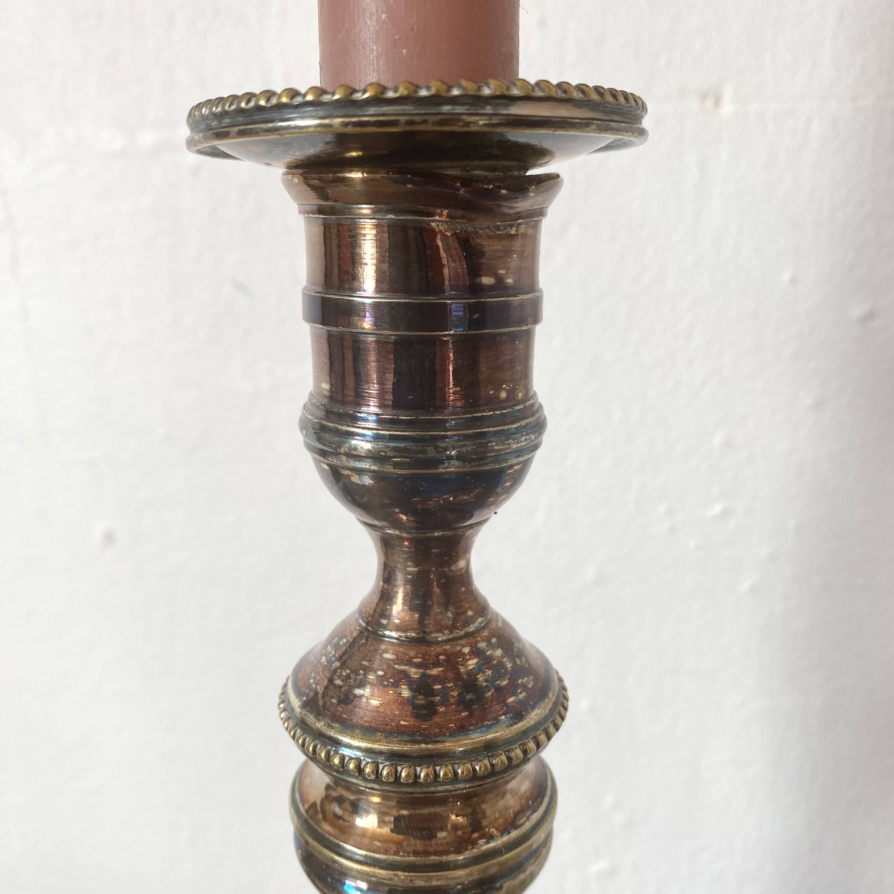 Pair of silver-plated metal candlesticks