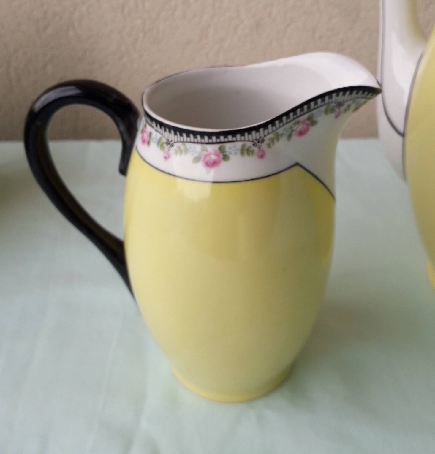 Coffee pot or teapot, sugar bowl and milk jug in porcelain.