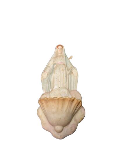 Ceramic holy water font with a representation of a woman