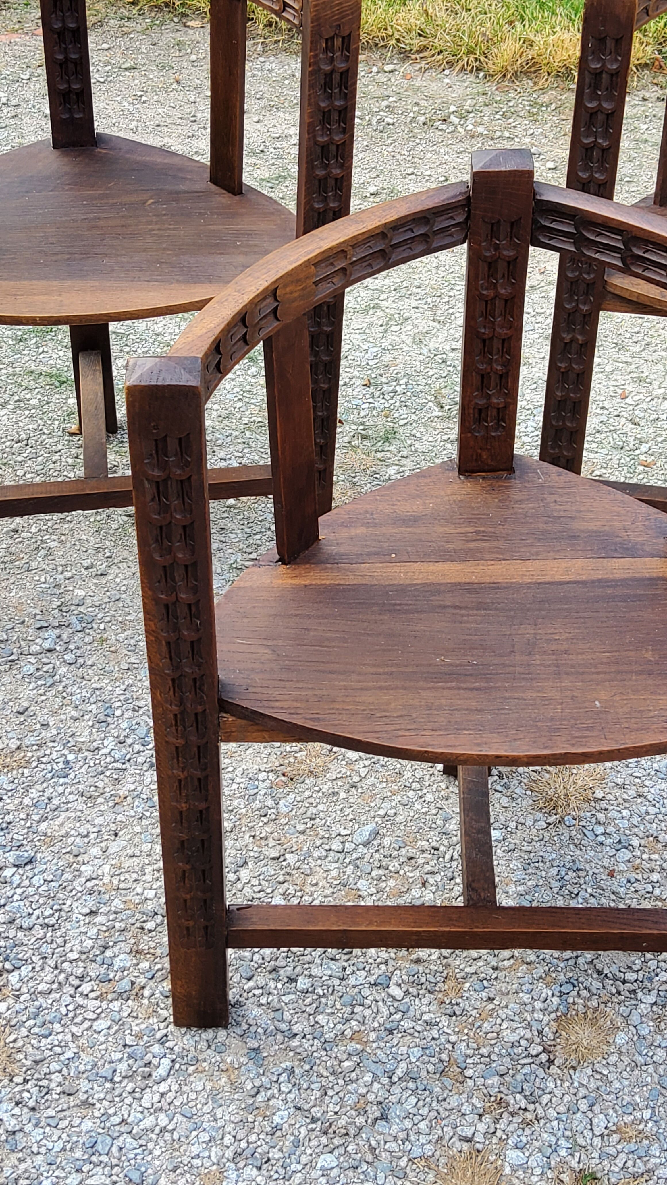 Set of three brutalist tripod armchairs in carved solid oak