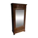 Antique wardrobe with a mirror door.