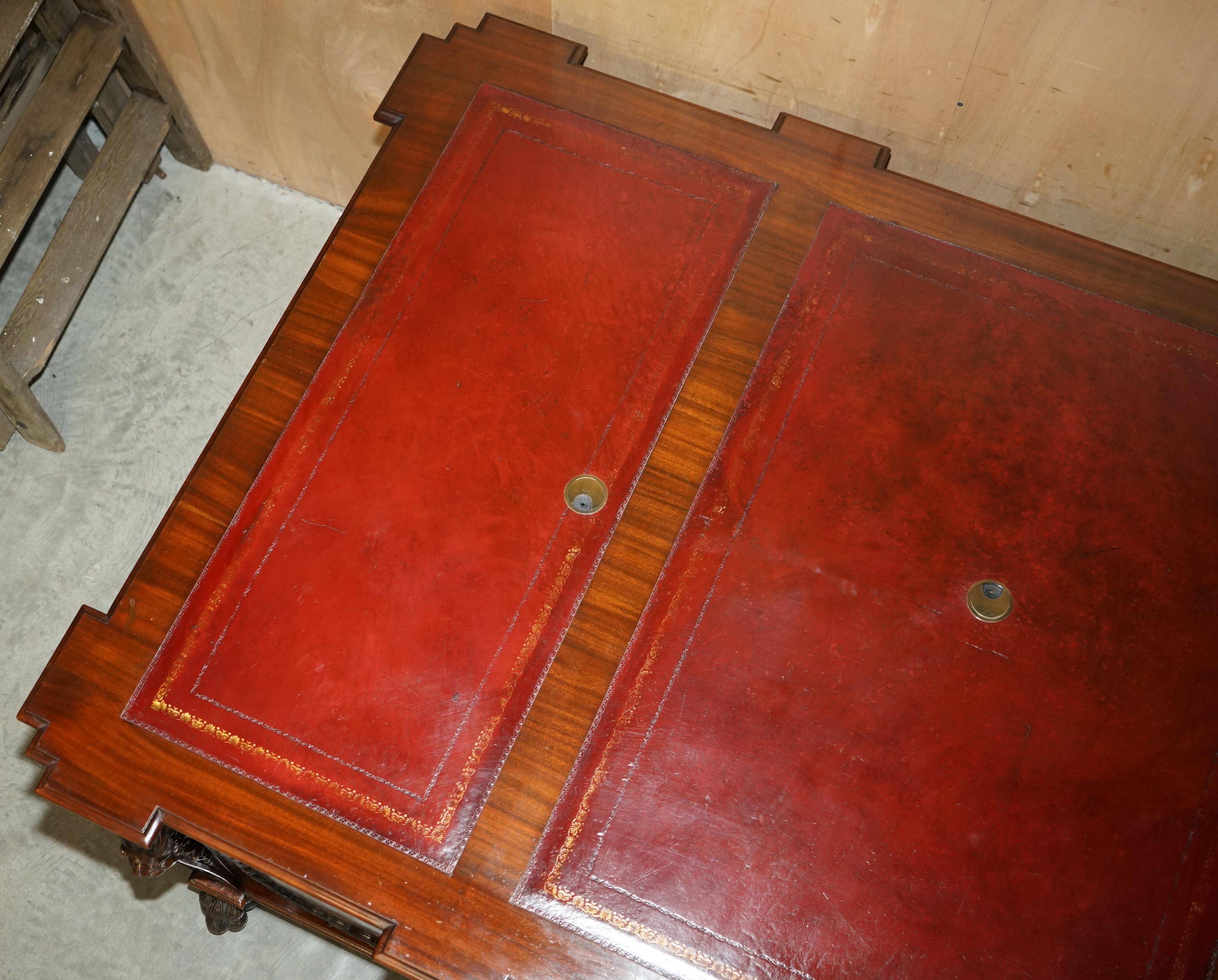 Partner desk with two carved columns featuring lion heads, according to Thomas Chippendale, restored.