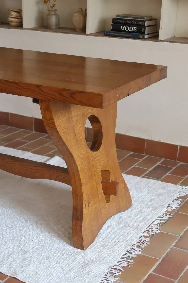 Solid wood dining table, sculpted brutalist base, 1960s.