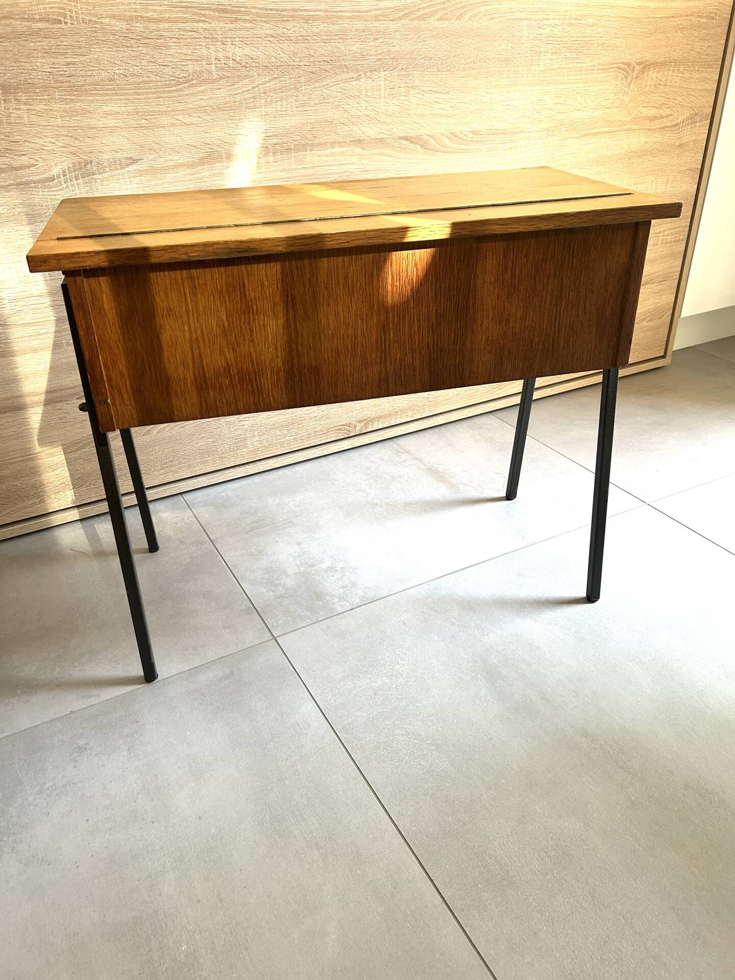 Vintage 1950s sewing machine with blonde oak veneer.