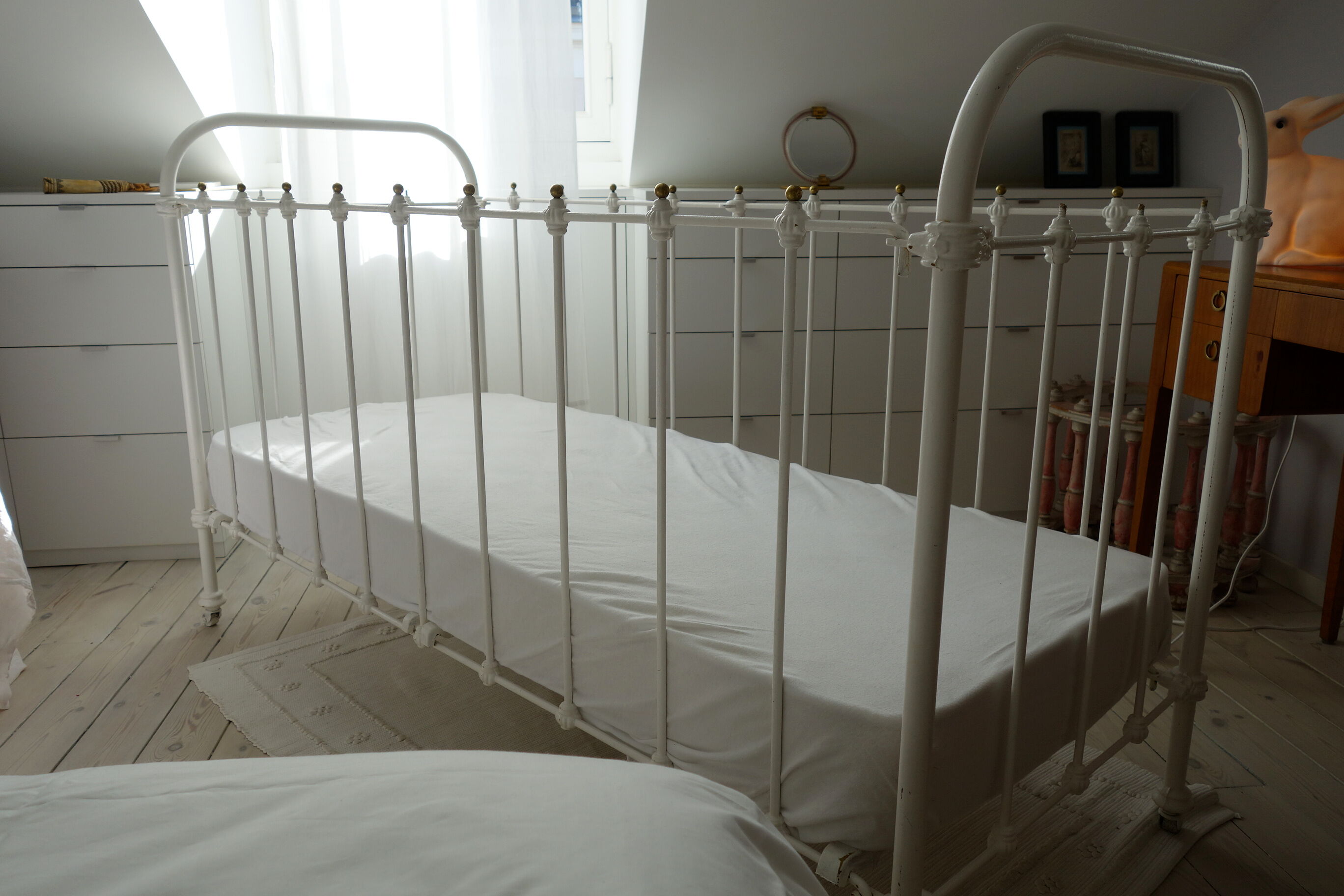 Old bed in wrought iron and brass balls