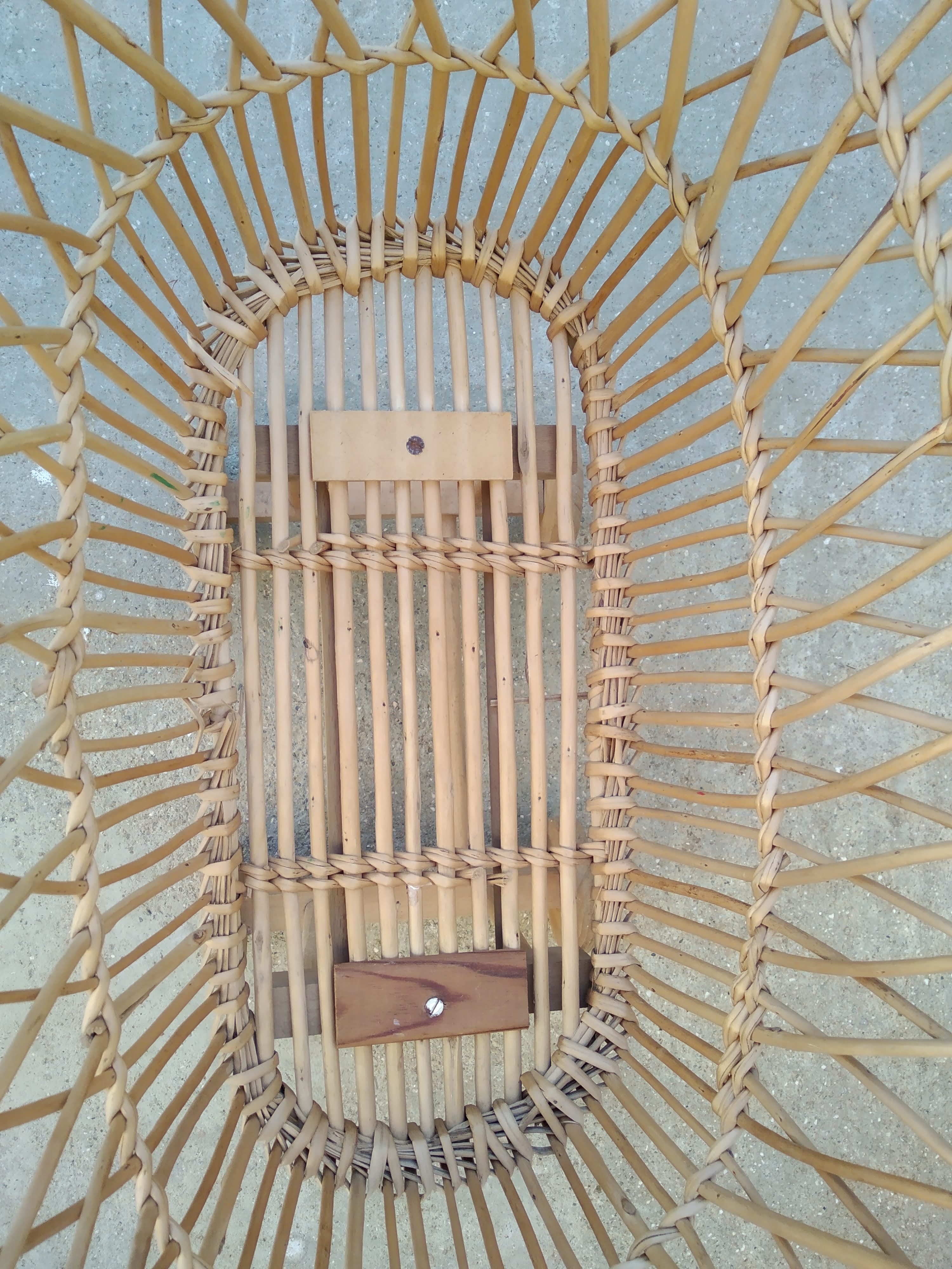 Rattan cradle for doll on vintage wheels