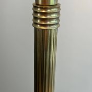 Neoclassical brass floor lamp with claw feet from Maison Jansen.