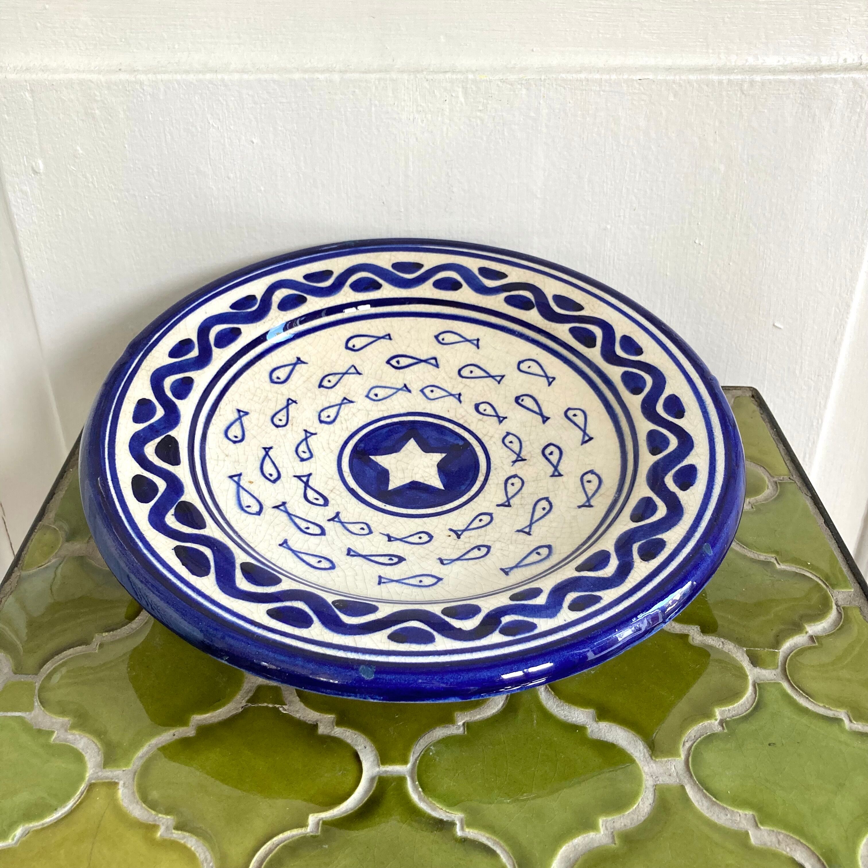 Decorative ceramic deep plate with fish decoration