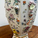 Porcelain vase with flower decorations by Dawen Wang.