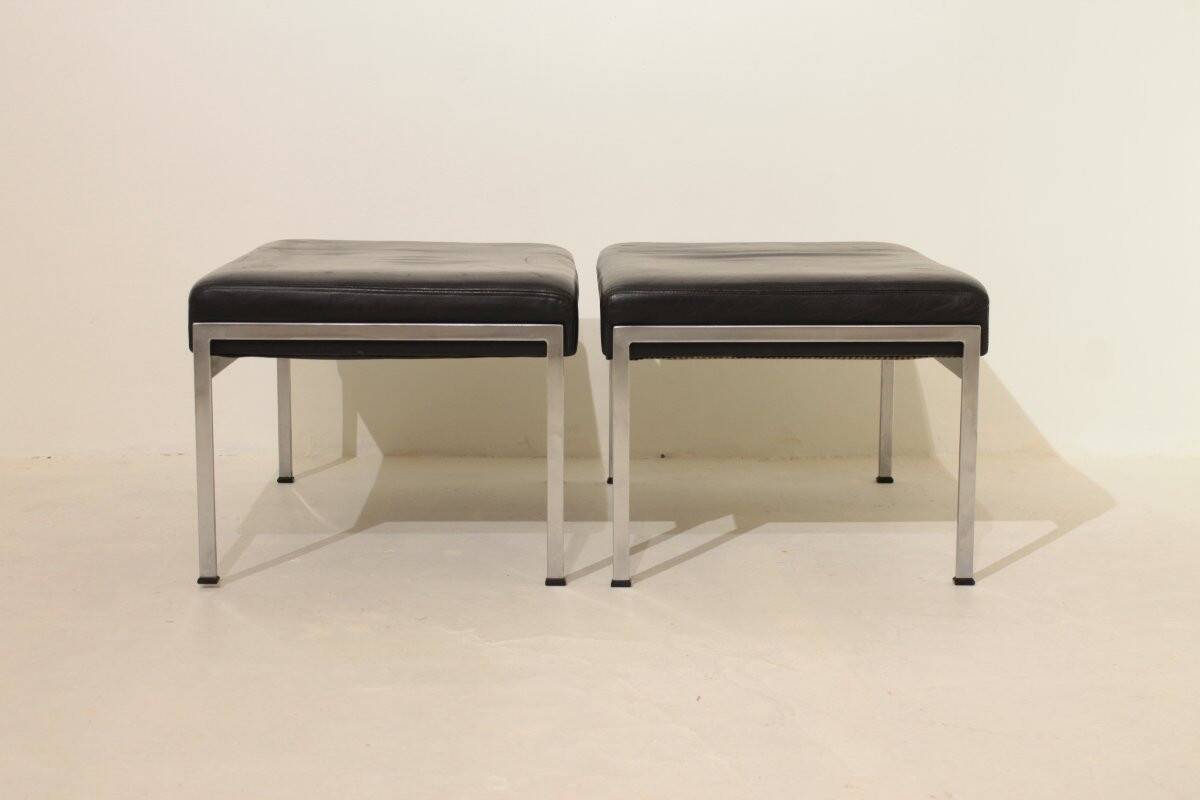 Pair of designer leather and brushed stainless steel footrests - Rob Parry
