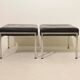 Pair of designer leather and brushed stainless steel footrests - Rob Parry