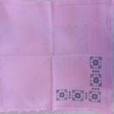 Large vintage linen tablecloth embroidered in pink and 12 matching napkins.