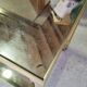 Vintage golden metal rolling dessert trolley