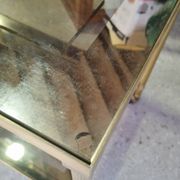 Vintage golden metal rolling dessert trolley