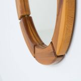 Sculptural wall mirror in solid pine